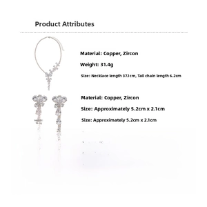 Macro detail of elegant zircon butterfly earrings and necklace set showing dimensions