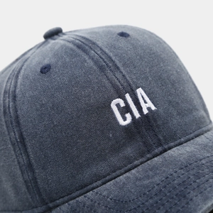 Close-up of CIA embroidery on dark blue washed cotton twill vintage baseball cap
