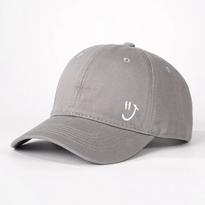 Dark grey cotton baseball cap with white smiley face embroidery and adjustable brim