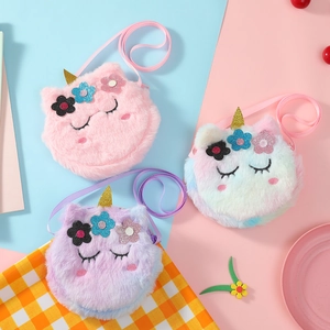 Detail of plush unicorn crossbody bags showing soft faux fur and glitter horn details