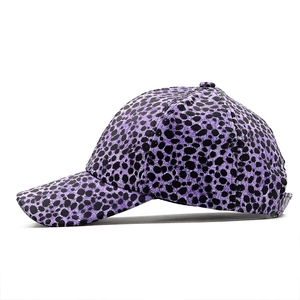 Side view of a purple leopard print baseball cap in PU leather with six-panel design