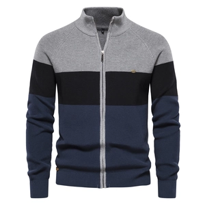 Detail of color-block knit cardigan with ribbed cuffs and high-quality metal zipper