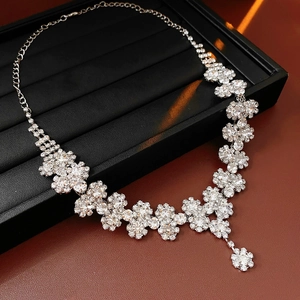 Close-up of sparkling rhinestone sunflower pendant necklace on a jewelry display