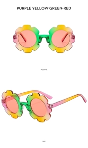 Detail view of sunflower-shaped kids sunglasses with colorful round frames and red lenses