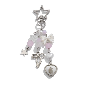 Detail of silver star keychain with pink beads, white bows and a cute cat heart pendant