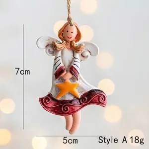 Detail of vintage resin angel ornament with white wings and star for Christmas tree