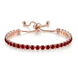 Adjustable rose gold tennis bracelet with a single row of sparkling red crystals