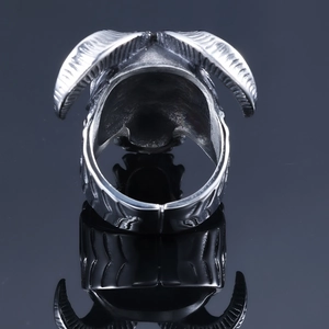 Detailed back view of silver horn skull ring with polished gothic texture and ring band