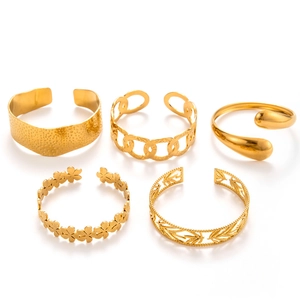 Set of five wide gold-plated stainless steel bangles with floral and hollow geometric patterns