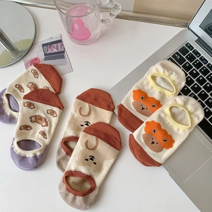 Close-up of three pairs of cute cartoon bear pattern low-cut cotton invisible socks