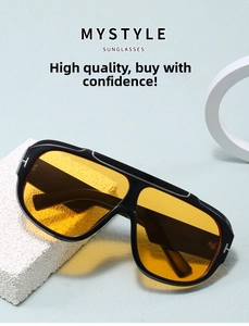 Detail of metal T-shape hinge on black pilot sunglasses with transparent yellow lenses