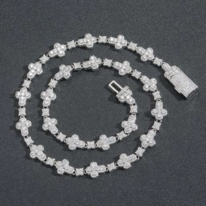 Detail of silver plated cross link necklace with shimmering micro-paved zircons and clasp
