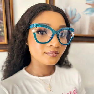 Teal cat eye blue light blocking glasses for women with elegant pearl accents