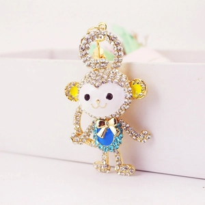 Sparkling crystal encrusted monkey keychain with colorful enamel and gold ring