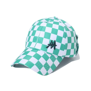 Detail of green and white checkered baseball cap with black embroidered lettering