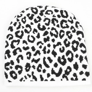 Close-up of leopard print knitted beanie showing soft winter fabric and texture