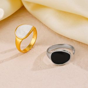 Minimalist oval enamel open rings in gold and silver finish on silk background