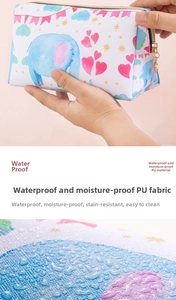Detail of waterproof PU leather cosmetic bag with elephant print and gold hardware zipper