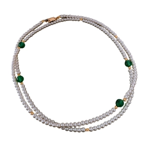 Double-layer white faux pearl necklace with green accent beads on white background