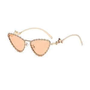 Cat eye sunglasses with gold star and butterfly metal frame and orange heart lenses