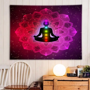 Detail of a meditation tapestry with chakra silhouette and mandala starry background