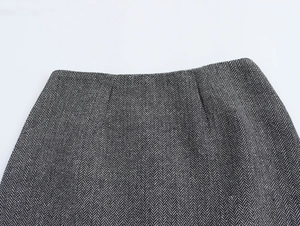 Macro view of black and white herringbone fabric texture on the elegant skirt waist