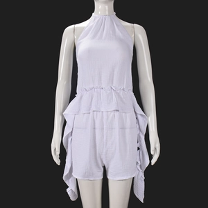 Detail of white crepe halter top and shorts set showing rich textured fabric on mannequin