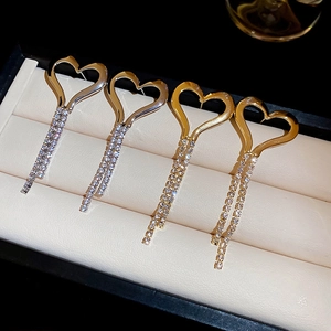 Elegant heart tassel earrings with sparkling zircon stones in gold and silver finish