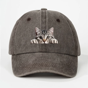 Close-up of a funny grey tabby cat print on a washed cotton baseball cap in charcoal