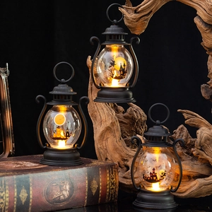 Three vintage Halloween LED lanterns with castle silhouettes and warm festive lighting
