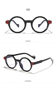 Detailed views of round black glasses with red hinge accents from front and 45-degree angles
