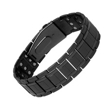Macro detail of black titanium magnetic health bracelet with embedded ion therapy stones