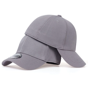 Detail of grey baseball caps in honeycomb fabric showing the size label for 55-58cm