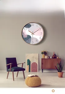 Modern 30cm wall clock with rose gold frame and geometric abstract dial in living room