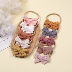 10-piece set of soft nylon baby headbands with assorted cotton bow embroidery