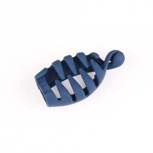 Detail of dark blue matte banana hair clip showing its secure comb-like inner structure