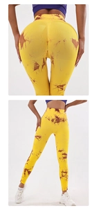 Détail du legging de yoga jaune tie-dye taille haute avec impression 3D et effet galbant