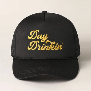 Close-up of black trucker hat featuring golden Day Drinkin' embroidery and mesh back