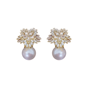 Elegant gold earrings with sparkling crystals and large grey pearls on white background