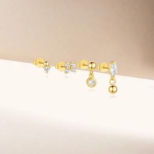 Macro shot of gold-plated S925 silver earring set with sparkling zircon crystal details