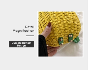 Detailed view of the durable bag base with green leather patch and gold metal feet