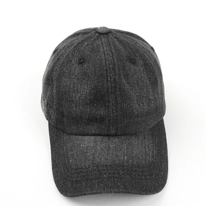 Detailed top view of dark grey washed denim baseball cap with vintage cotton texture