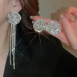 Elegant silver flower jewelry set with sparkling tassels and pavé rhinestone crystals
