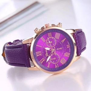 Detail of purple leather strap quartz watch with rose gold case and Roman numerals