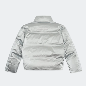 Close-up of silver metallic puffer jacket back featuring the SMFK logo and quilted texture