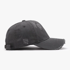 Distressed charcoal grey cotton baseball cap with vintage washed fabric and ripped details