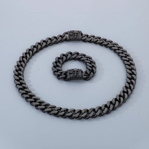 Black stainless steel Cuban link necklace and bracelet set with skull clasp detail