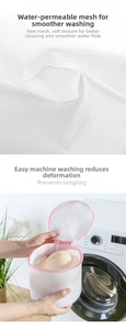 Close-up of durable white mesh laundry bag with pink zipper for delicate clothes protection