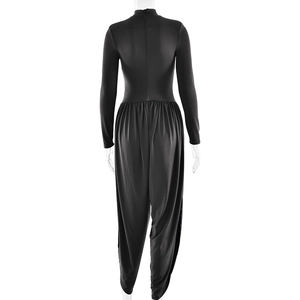 Back view of black long-sleeved jumpsuit with high neck and slim fit draped design
