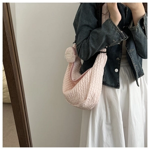 Detailed close-up of pink bubble pleated texture and matching circular coin pouch accessory